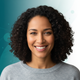 Headshot portrait of a smiling woman, conveying satisfaction and trust.